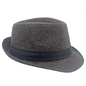 Detailed texture of a brown wool fedora hat with a black ribbon band for men
