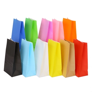 Colorful craft paper gift bags in assorted vibrant colors on a clean white background