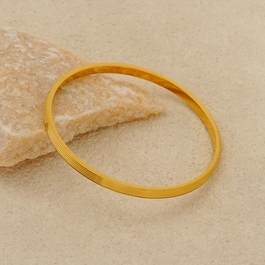 Minimalist gold plated titanium steel bangle with multi-layer textured groove design