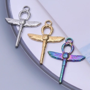 Three Ankh cross pendants with scarab wings in gold, silver, and iridescent steel finish