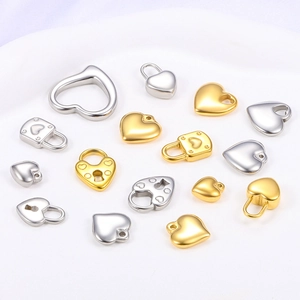 Detailed collection of polished gold and silver heart pendants and lock charms for jewelry