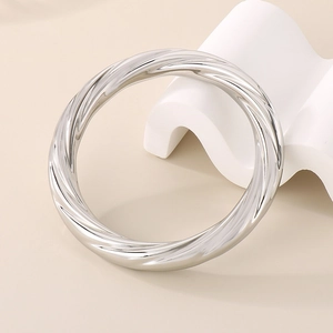 Silver twisted spiral stainless steel open cuff bracelet with metallic luster finish