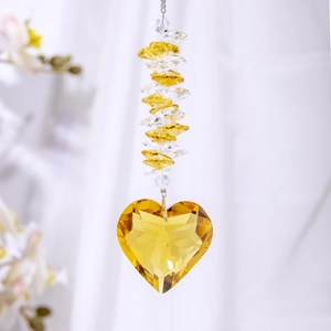 Detailed close-up of a yellow heart crystal suncatcher with faceted beads and silver chain