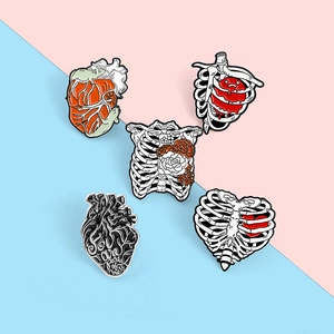 Set of 5 medical enamel pins featuring anatomical heart and rib cage designs