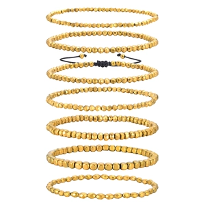 Set di bracciali con perline dorate, cubi sfaccettati e cordino nero regolabile