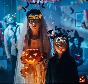 Kids wearing Happy Halloween party glasses with pumpkin and ghost motifs for festive fun