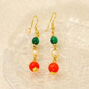 Vintage gold drop earrings with green agate, white pearl, and red beads on glass