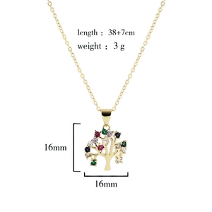Macro shot of 18K gold plated Tree of Life pendant with multicolor cubic zirconia gems