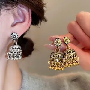 Vintage silver and gold Jhumka tassel earrings with ornate floral relief for women