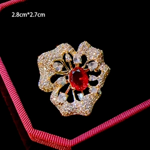 Elegant floral brooch with red gemstone and micro-set zircons, size 2.8cm by 2.7cm