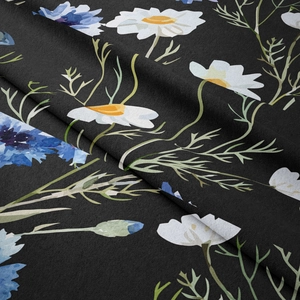 Close-up of floral tapestry showing soft fabric texture with daisies and cornflowers