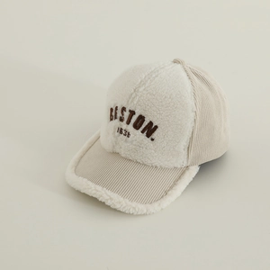 Detailed close-up of BOSTON 1630 embroidery on sherpa and corduroy baseball cap