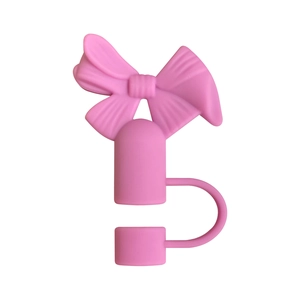 Détail du capuchon de paille en silicone rose en forme de nœud pour tasses Stanley