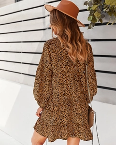 Back view of leopard print tiered mini dress with long sleeves and layered ruffle hem