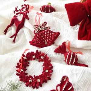 Red flocked velvet Christmas ornaments set with reindeer and bells for tree decoration