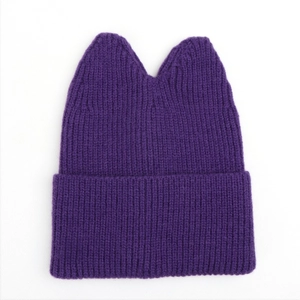 Detailed knit texture of purple cat ear hat with ribbed pattern and folded brim design
