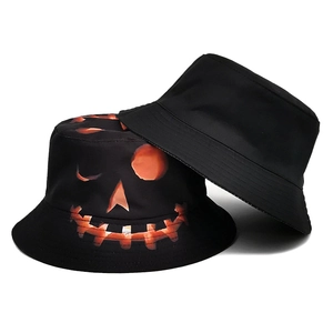 Reversible Halloween bucket hat featuring black fabric and orange pumpkin face prints