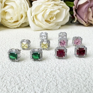 Asscher cut square gemstone stud earrings in various colors with floral background