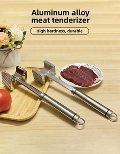 Detail of silver aluminum meat mallet with dual-sided tenderizer teeth and hanging hook