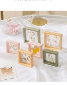 Detail view of colorful square transparent film jewelry display boxes for earrings and rings