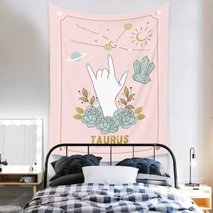 Detail view of Taurus zodiac wall tapestry with floral and celestial hand-drawn elements