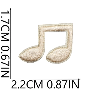 Macro shot of musical note embroidery patch with dimensions 1.7x2.2cm on white background
