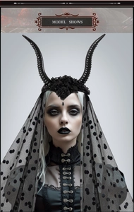 Detail of gothic queen black sheep horn headband with lace veil and floral accents