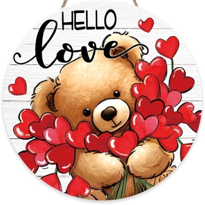 Detail of wooden Hello Love sign featuring a teddy bear holding red heart balloons