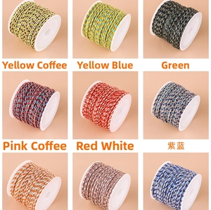 Macro detail of multi-color twisted cotton cord with gold thread for DIY jewelry making