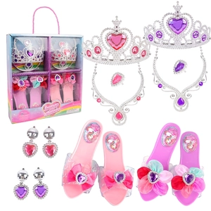 Detail of pink and purple princess dress-up set with toy heels and tiaras in a gift box