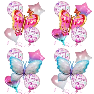 Detail of butterfly foil balloons and happy birthday stars for party decor