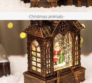 Detail of vintage bronze Christmas lantern with Santa scene and swirling glitter snow effect