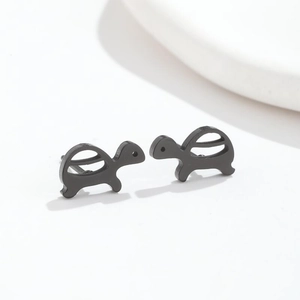 Detail view of mini turtle stud earrings in sleek black stainless steel finish