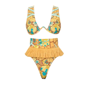 Close-up of yellow mosaic print bikini with fringe details and ethnic pattern