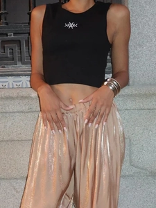 Street style glossy champagne metallic harem pants with a black cropped tank top set