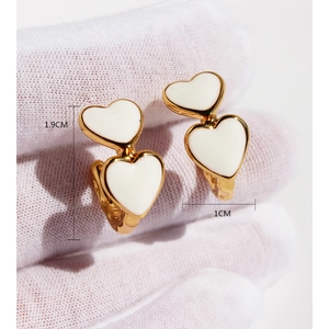 Vintage gold-plated double white enamel heart earrings measuring 1.9cm by 1cm