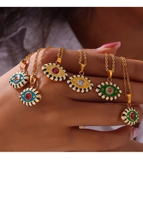 Detailed view of colorful evil eye pendants with enamel finish and crystal accents