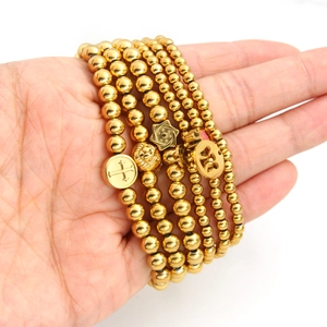 18K gold plated stainless steel beaded bracelet set with cross and smiley charms