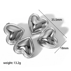 Detailed view of silver heart earrings with dimensions 35.5mm length and 13.2g weight