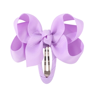 Close-up of lavender grosgrain ribbon bow hair clip with wrapped metal BB snap base