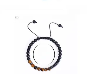 Detail showing 6mm tiger eye and matte stone beads with adjustable woven cord
