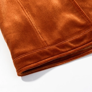 Detail view of caramel velvet fabric texture with high-quality double stitching finish
