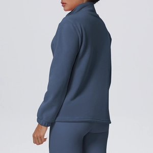Detail of dark blue fleece sports jacket showing stand collar and high-quality fabric texture