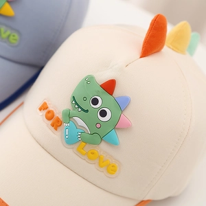 Kids cream canvas baseball cap with cute green dinosaur patch and orange brim
