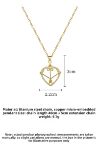 Detailed size specifications of gold heart and cupid arrow necklace with zircon stones