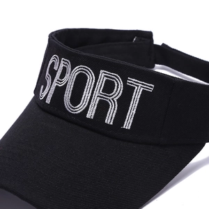 Detailed close-up of high-density cotton sport sun visor with silver SPORT embroidery