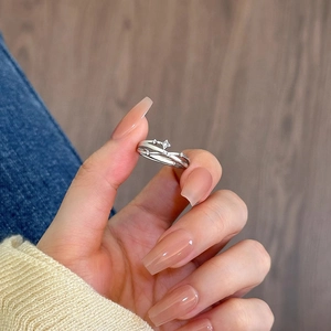 Adjustable silver star ring with zircon stones shown on hand for a delicate look