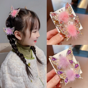 Cute butterfly hair clips for girls with pink and purple rhinestones and pom-pom decor