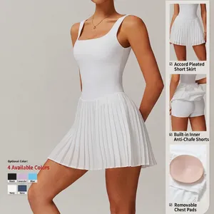 White pleated tennis dress with built-in shorts and removable pads for women sports