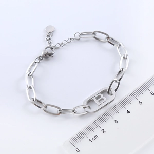 Minimalist stainless steel paperclip chain bracelet with oval letter B charm detail